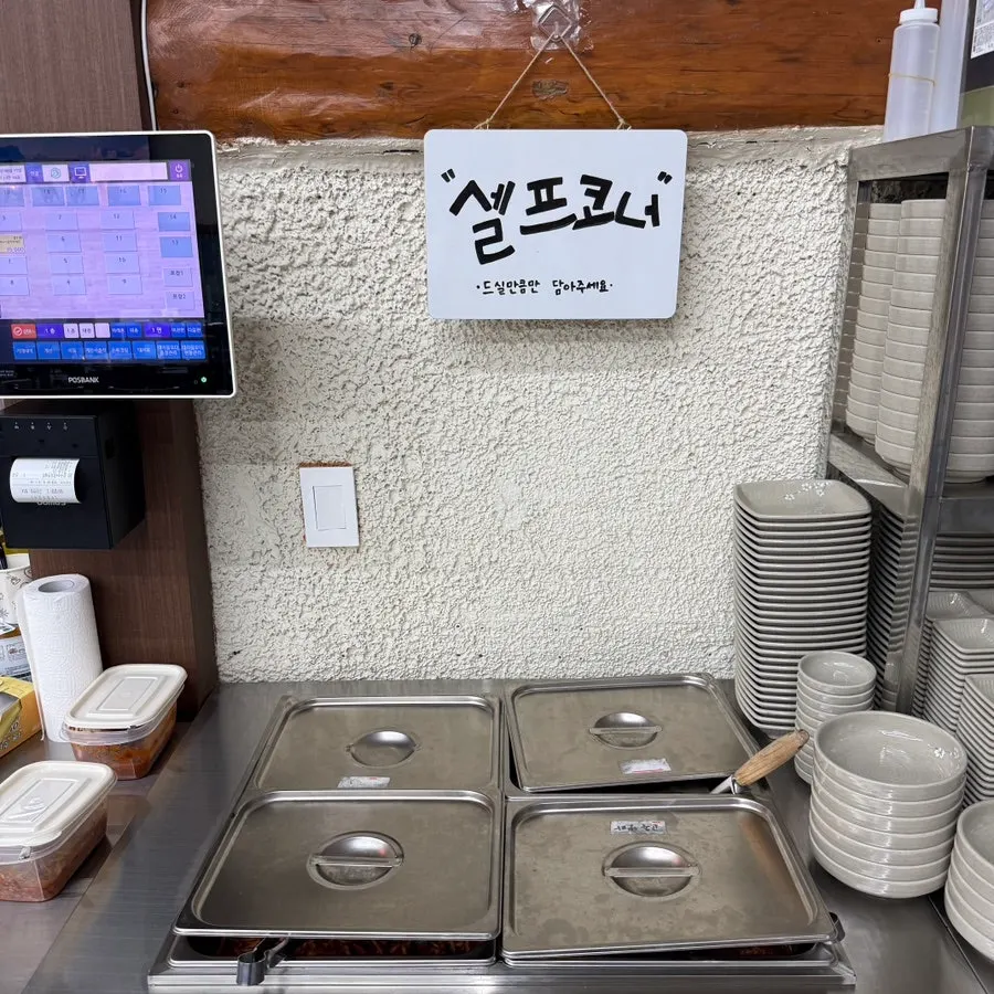 Corner of the restaurant with aprons and baby chairs