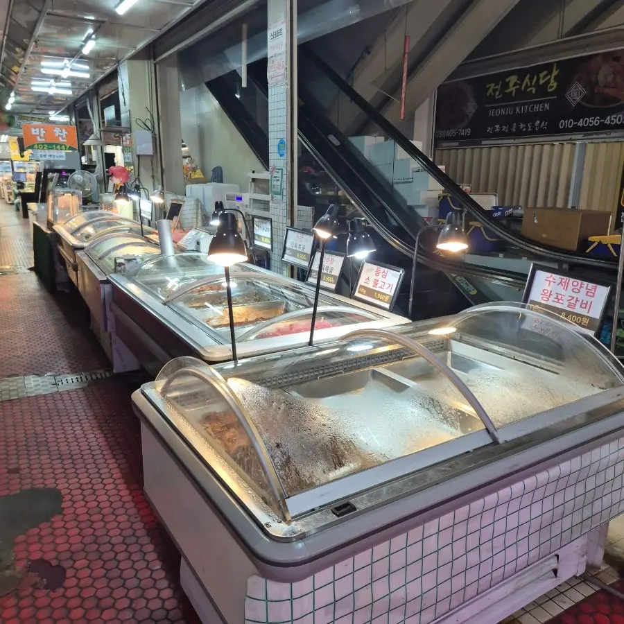 Refrigerated display of grilling cuts like ribeye and short rib meat