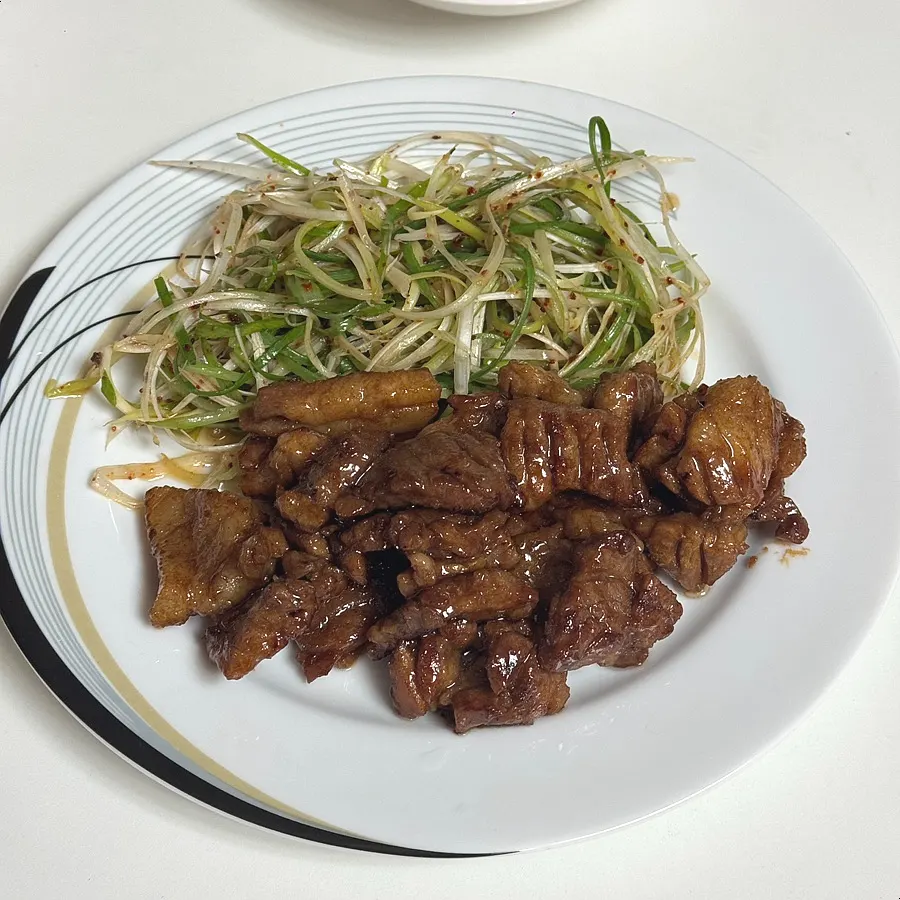 Grilled wangpo galbi piece with scallion shreds