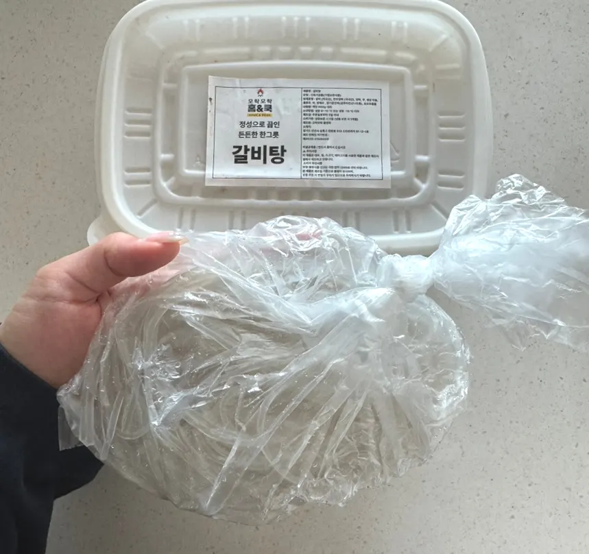 Frozen galbitang in a deep disposable container
