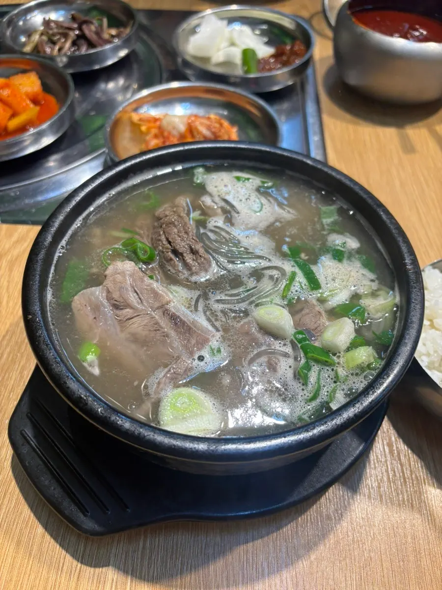 Galbitang served milky white in a stone pot