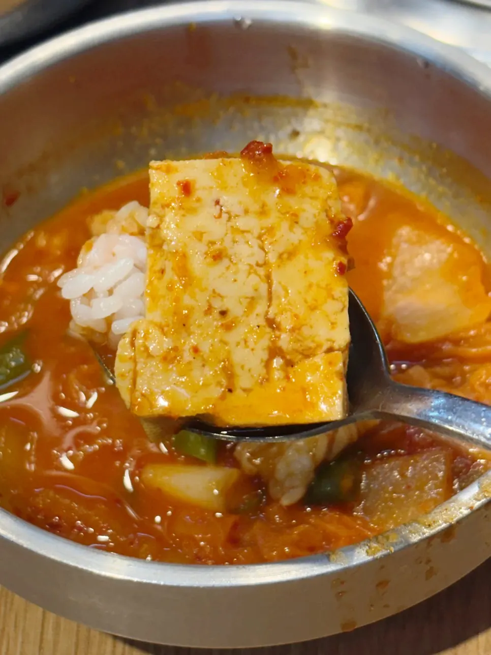 Kimchi jjigae served with a bowl of rice