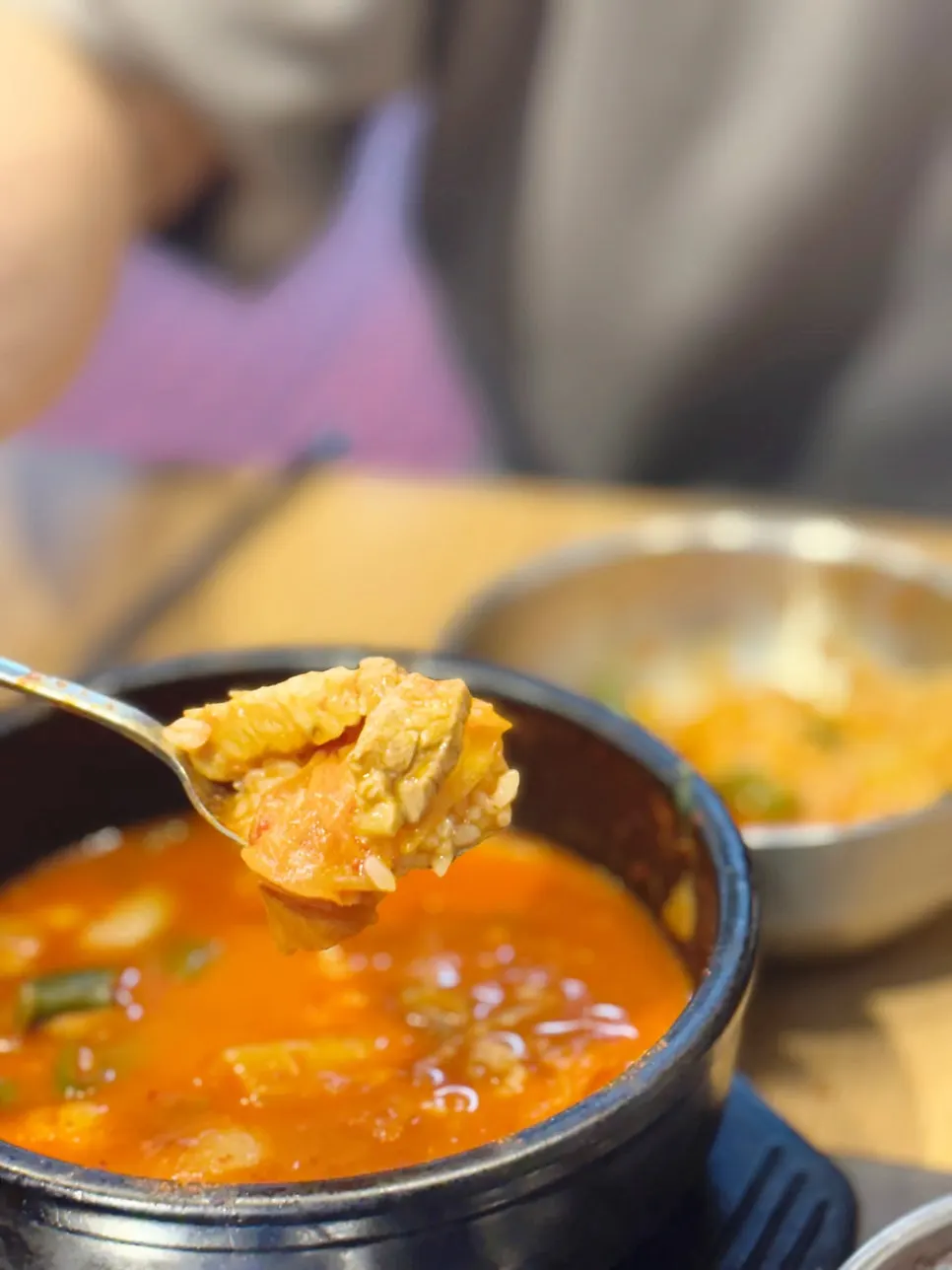 Spoonful of kimchi jjigae broth