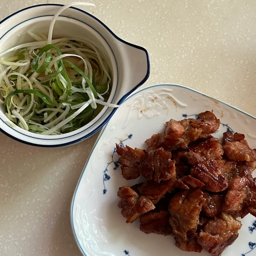 Packaged seasoned wang-po galbi with complimentary scallion strips