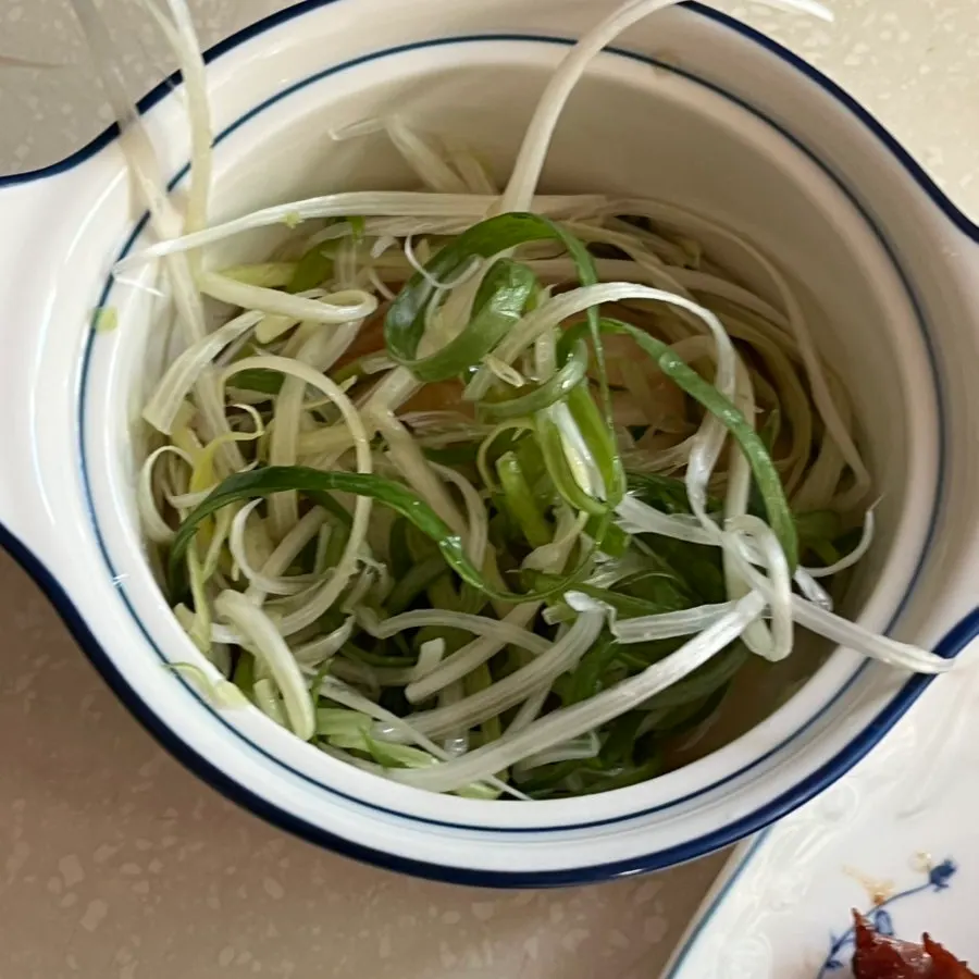 Seasoned wang-po galbi grilling on the pan