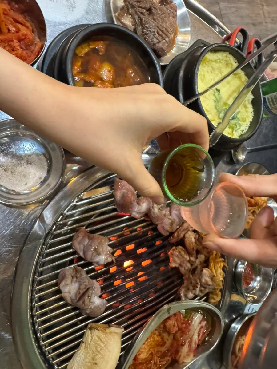 Meat grilling over charcoal