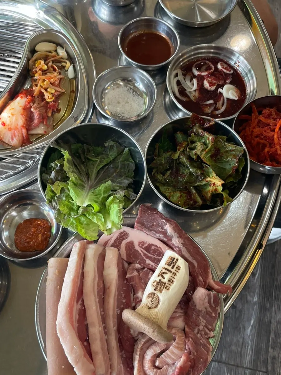 Table set with basic side dishes and meat