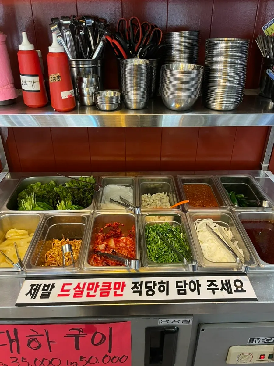 Pineapple and side dishes laid out at the self-serve bar
