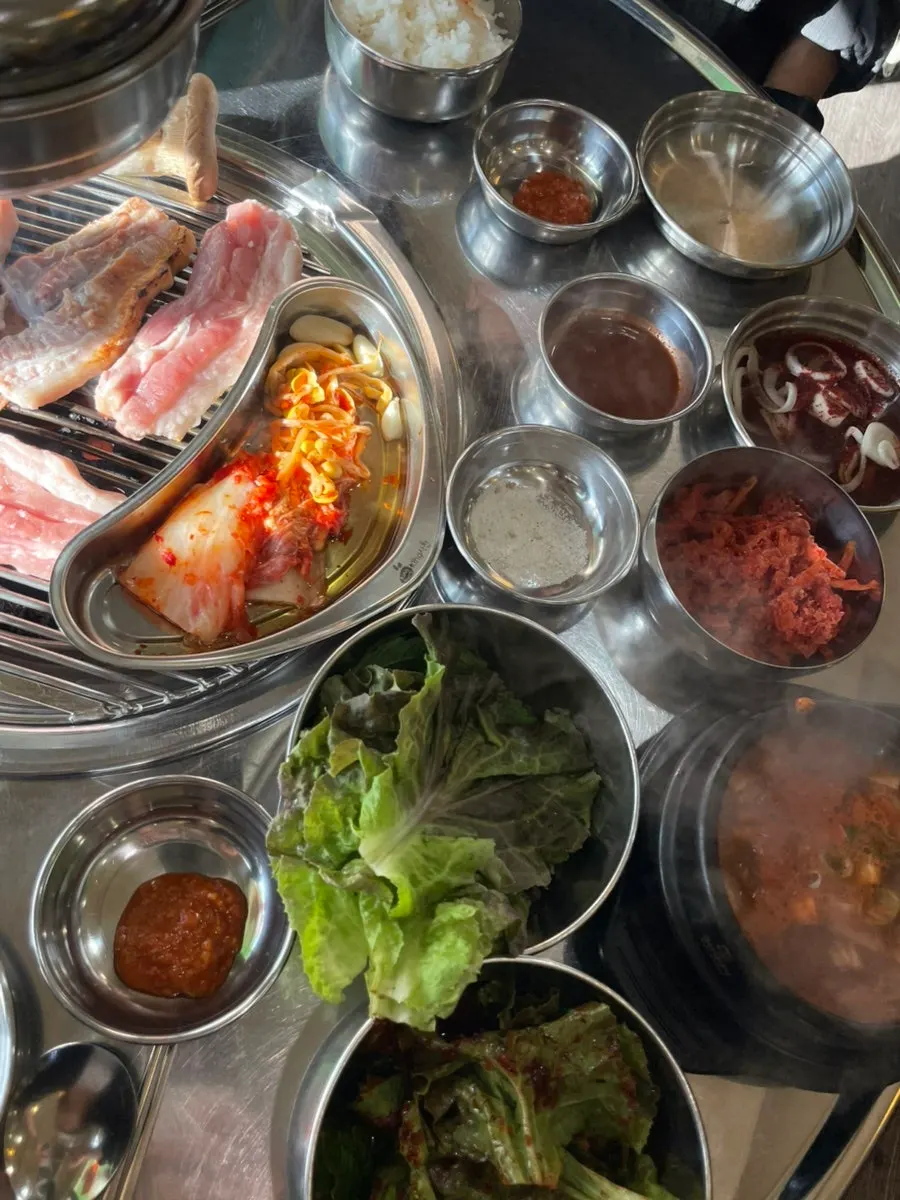 Table full of meat and side dishes