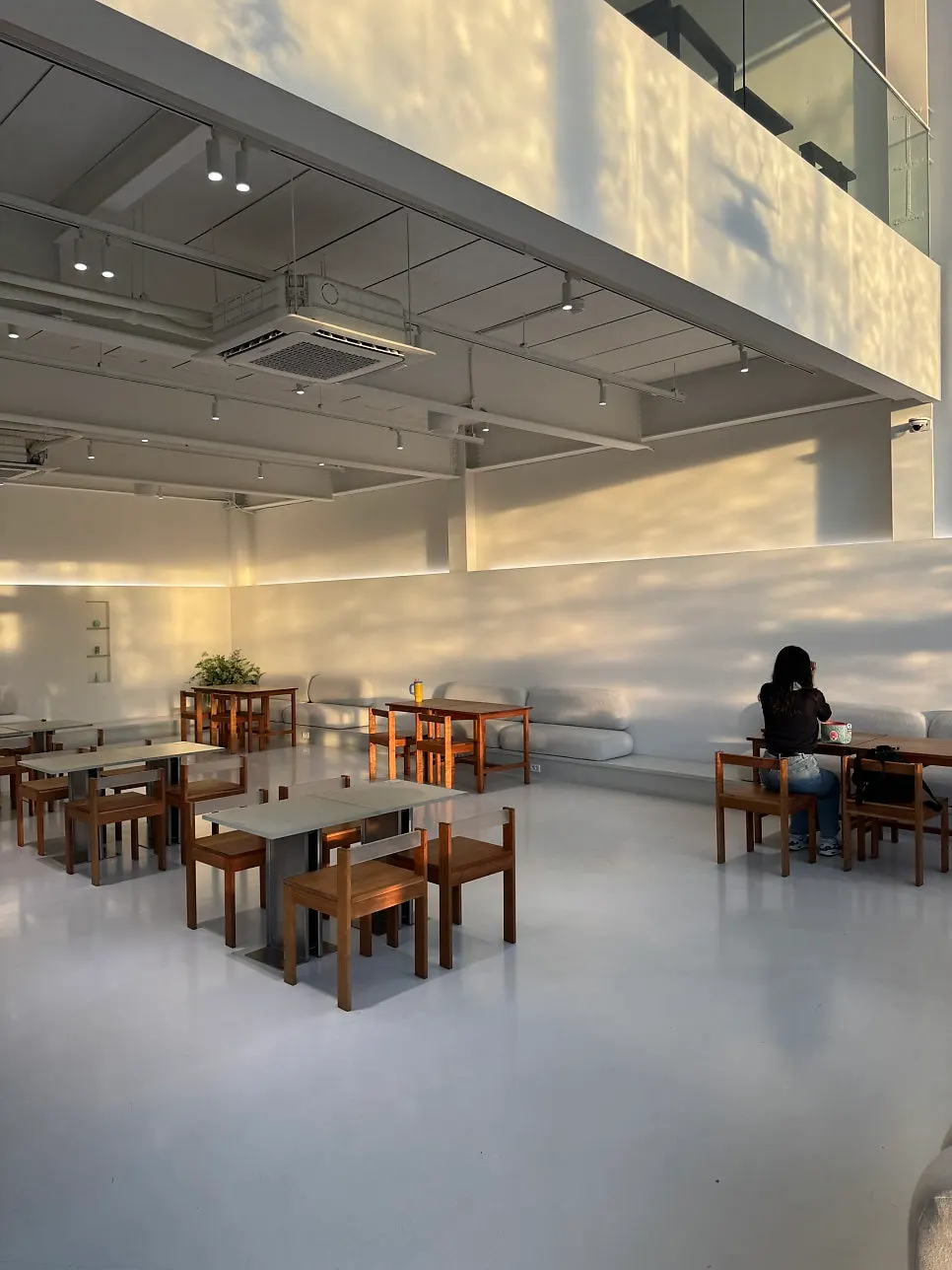 Spacious café interior with a high ceiling