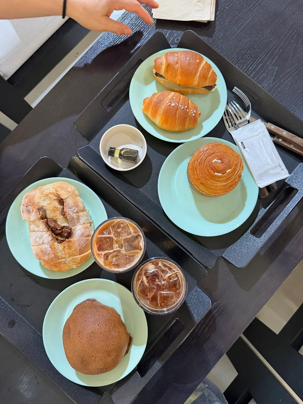 Bread and drinks filling a table