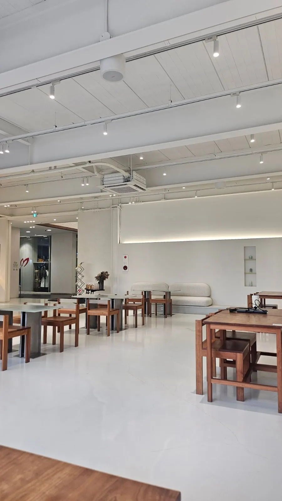 High-ceilinged first-floor seating area at Chat Baker