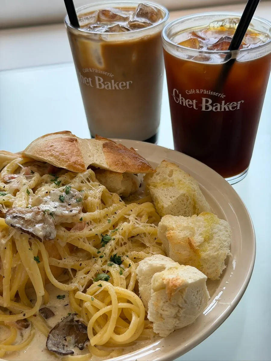 Panne pasta and a drink on the table