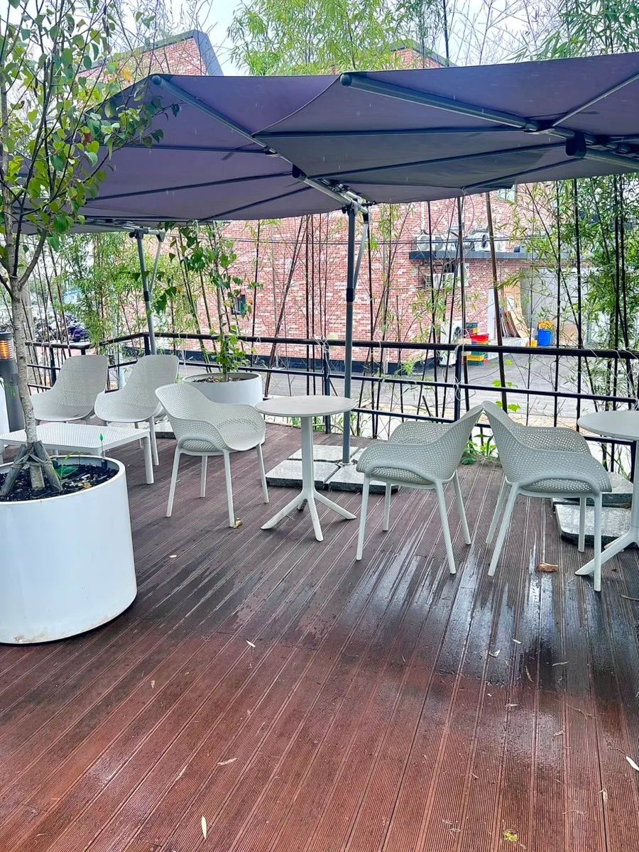 Soft sofa seats in front of the water curtain