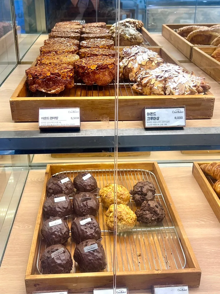Crumble and chocolate cake among other cakes on display