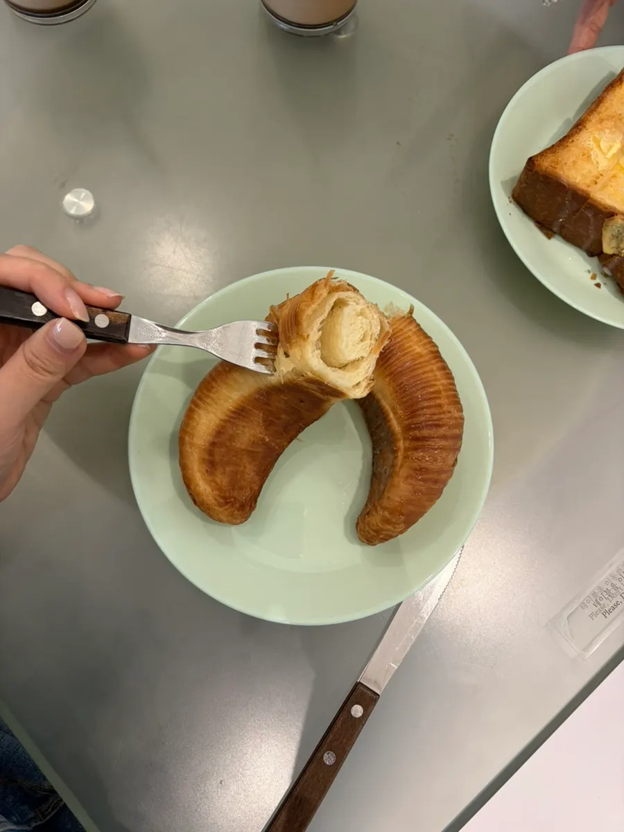 A latte with syrup settled at the bottom