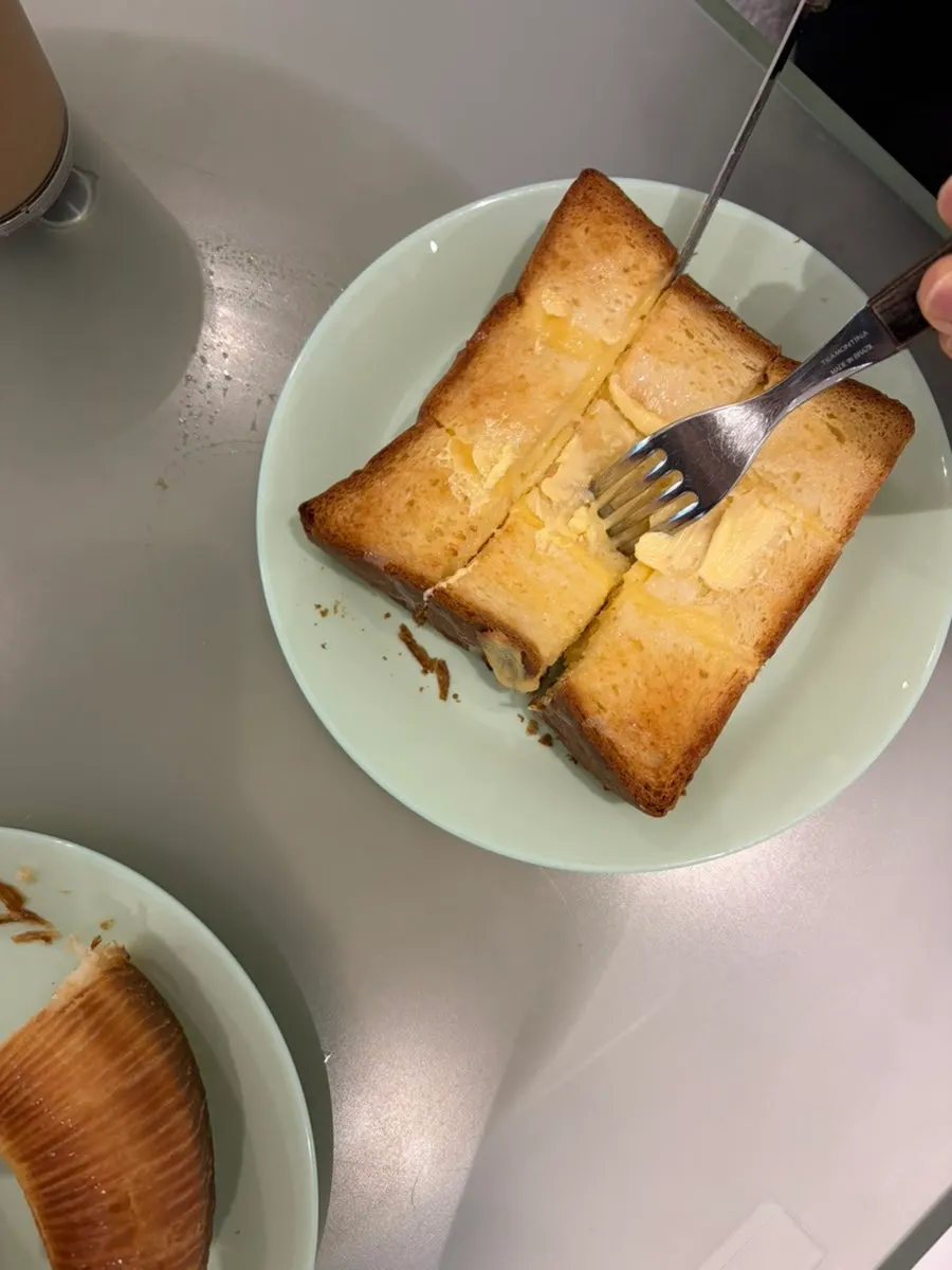 A light lunch table of bread and coffee