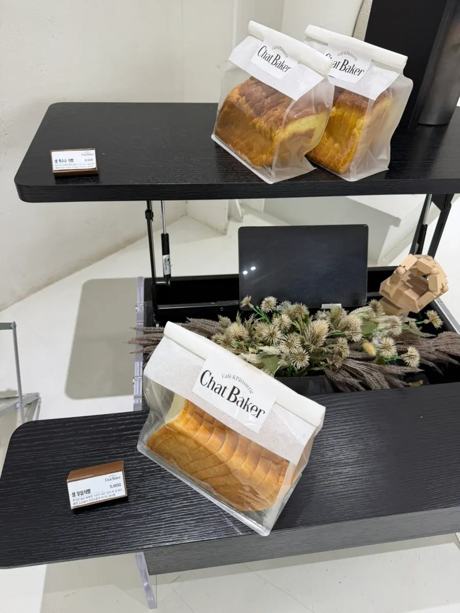 Sliced bread and chewy cookie display at Chat Baker