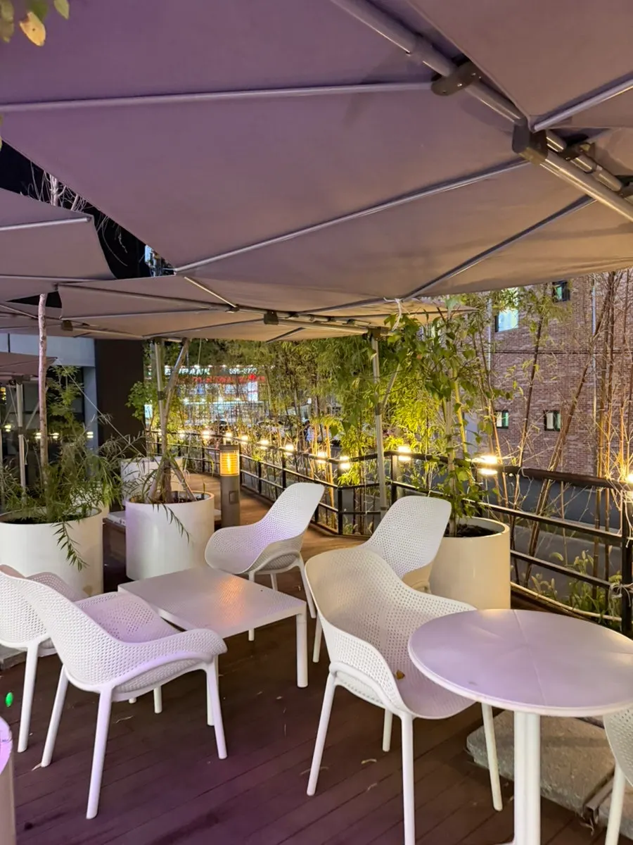 1st-floor outdoor terrace seating at Chat Baker