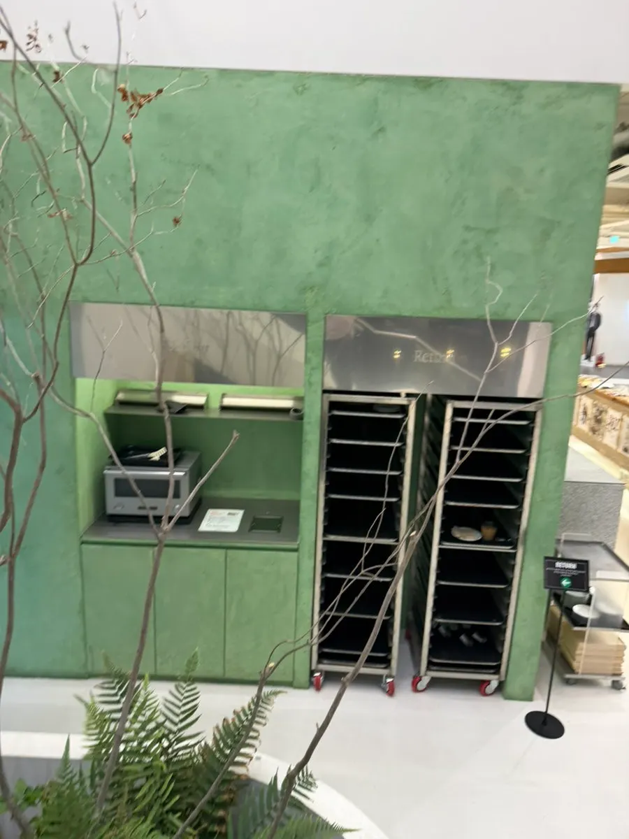 Emerald green wall interior at Chat Baker