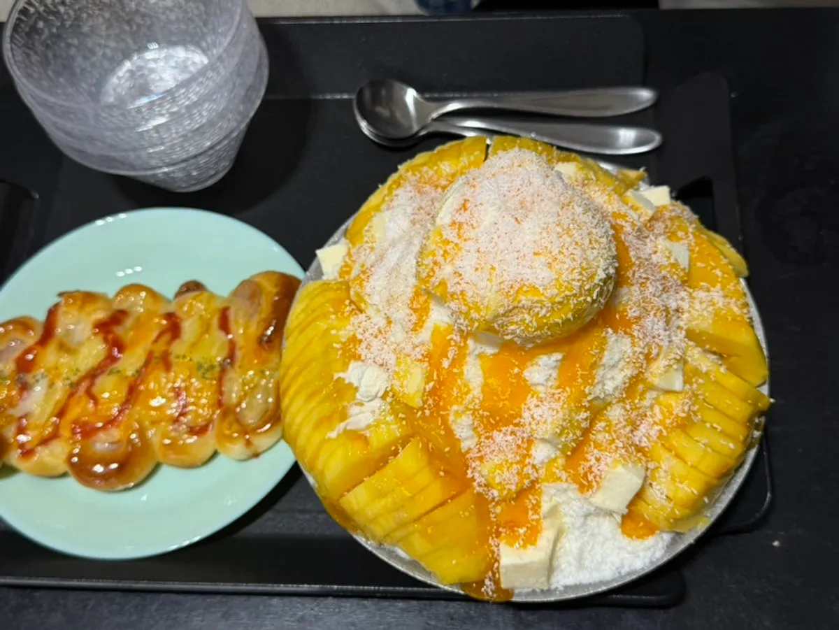 Chat Baker's coconut fresh mango bingsu piled high with mango