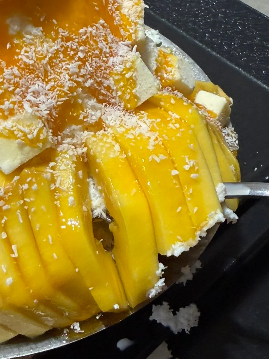 Close-up of fresh mango flesh scooped from the bingsu