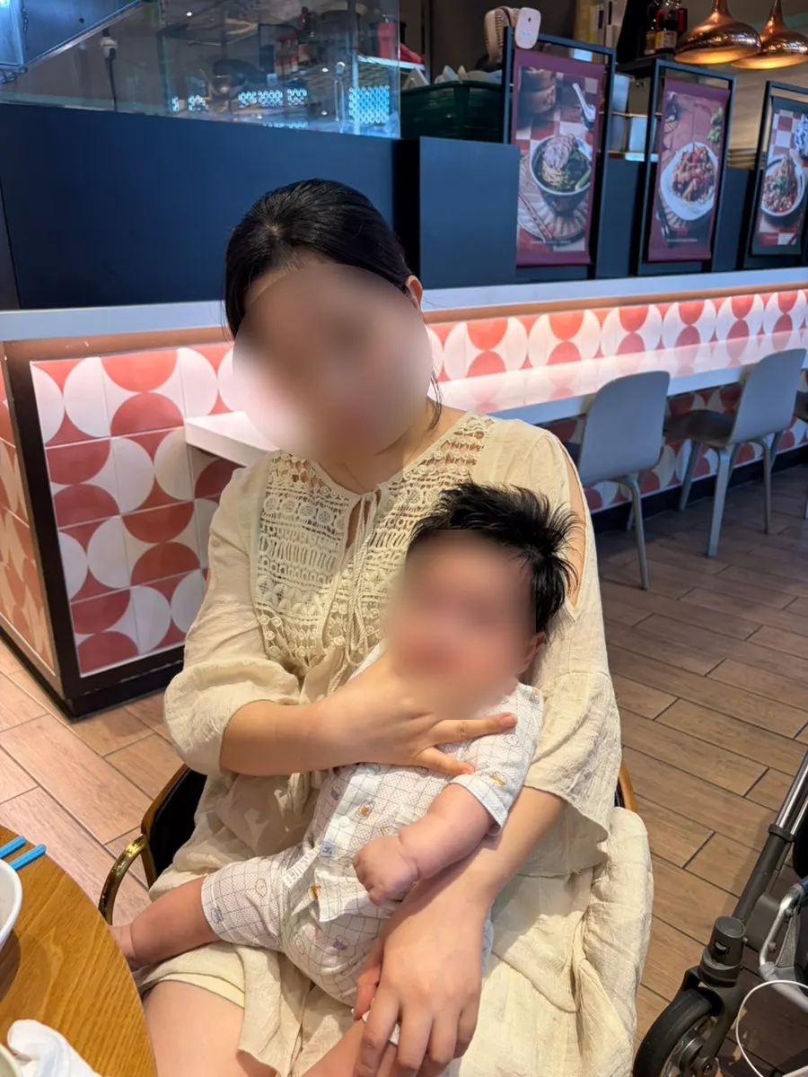 Baby sitting in the stroller during the meal