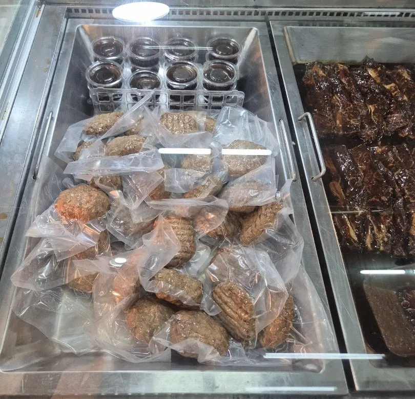 Display case of fresh meat and marinated meats