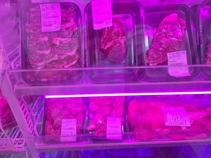 Display of bright red, cleanly trimmed raw meat