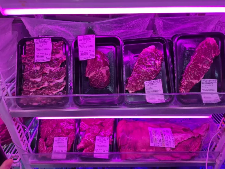Pork belly and pork shoulder in the meat display case