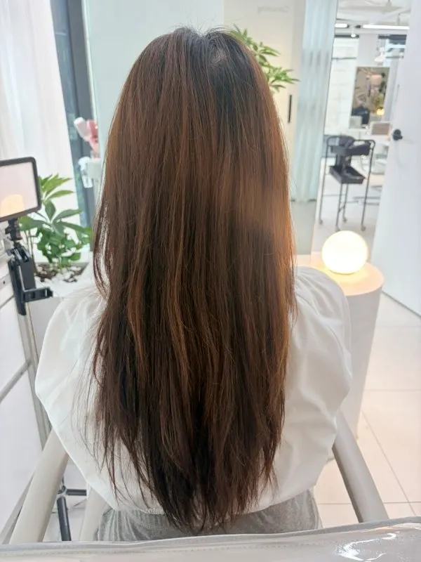 Long hair with yellow tones remaining before the dye