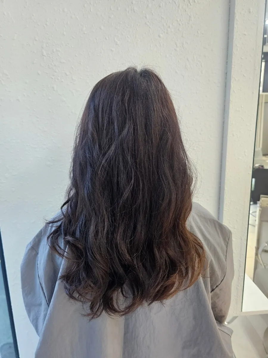 Hair trimmed to medium length