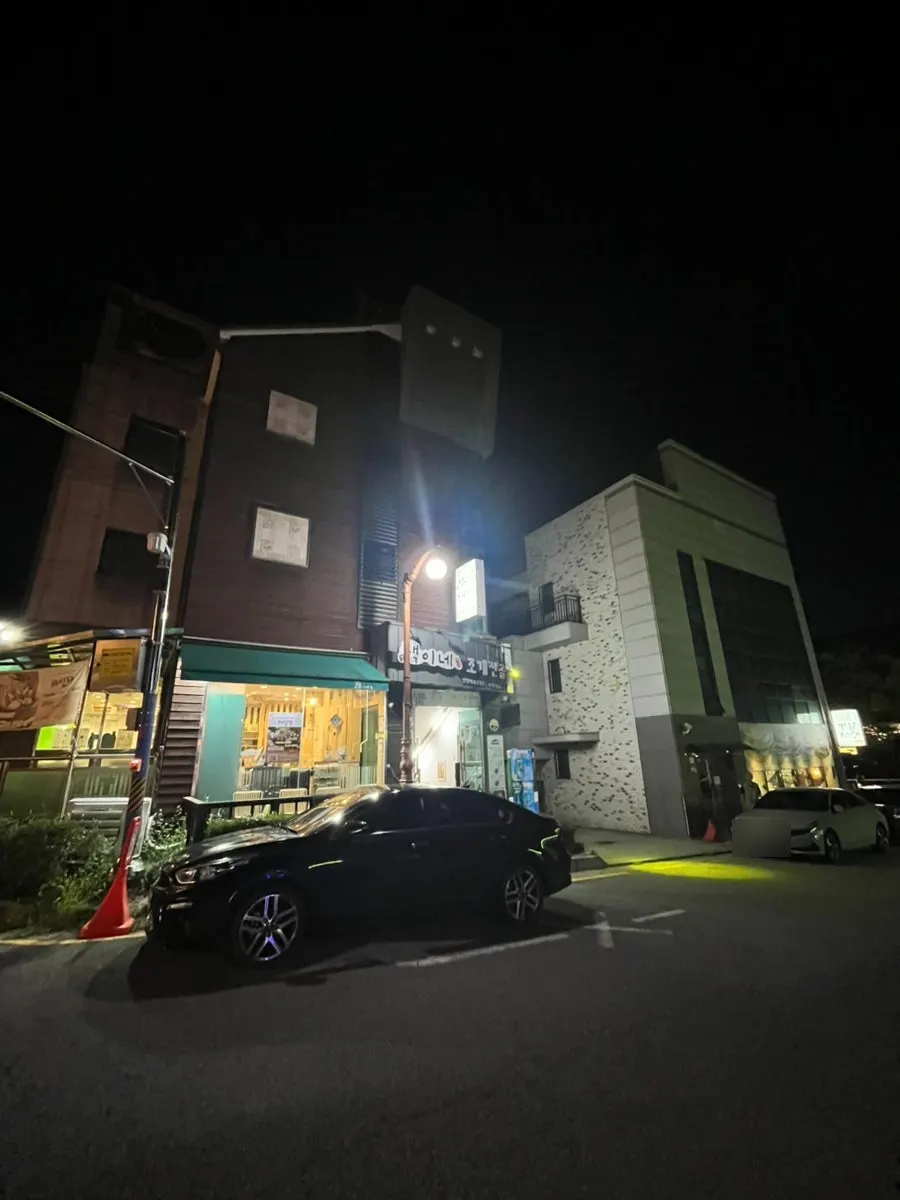 Restaurant exterior showing the parking space out front