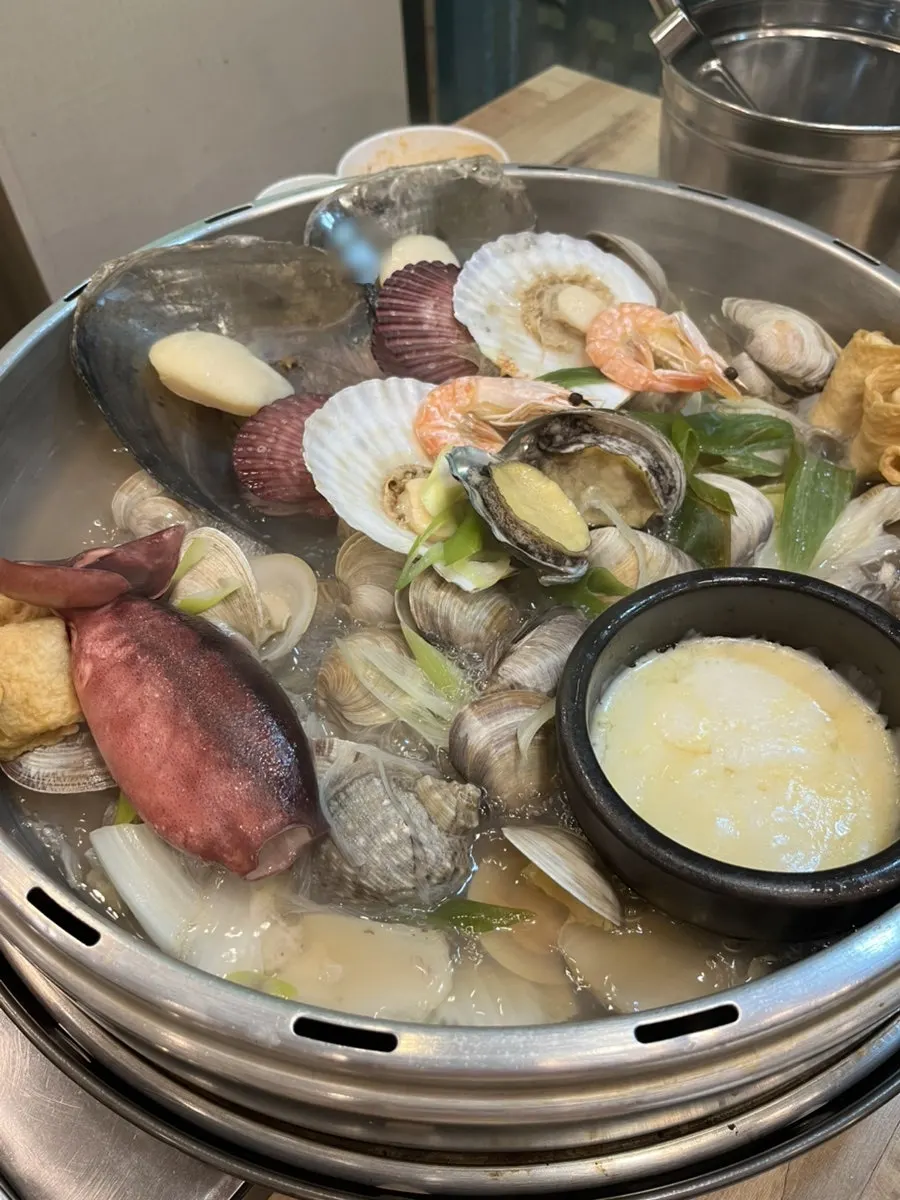 2-person clam hot pot piled high with seafood