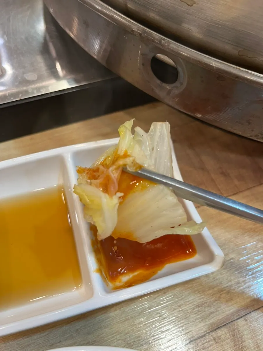Hot pot broth with mushrooms and napa cabbage