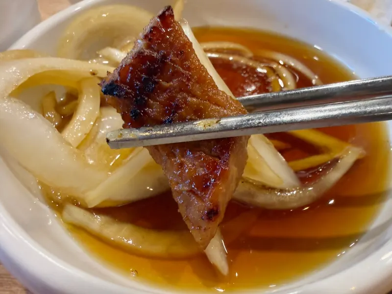 Charcoal-grilled pork galbi cut into bite-sized pieces