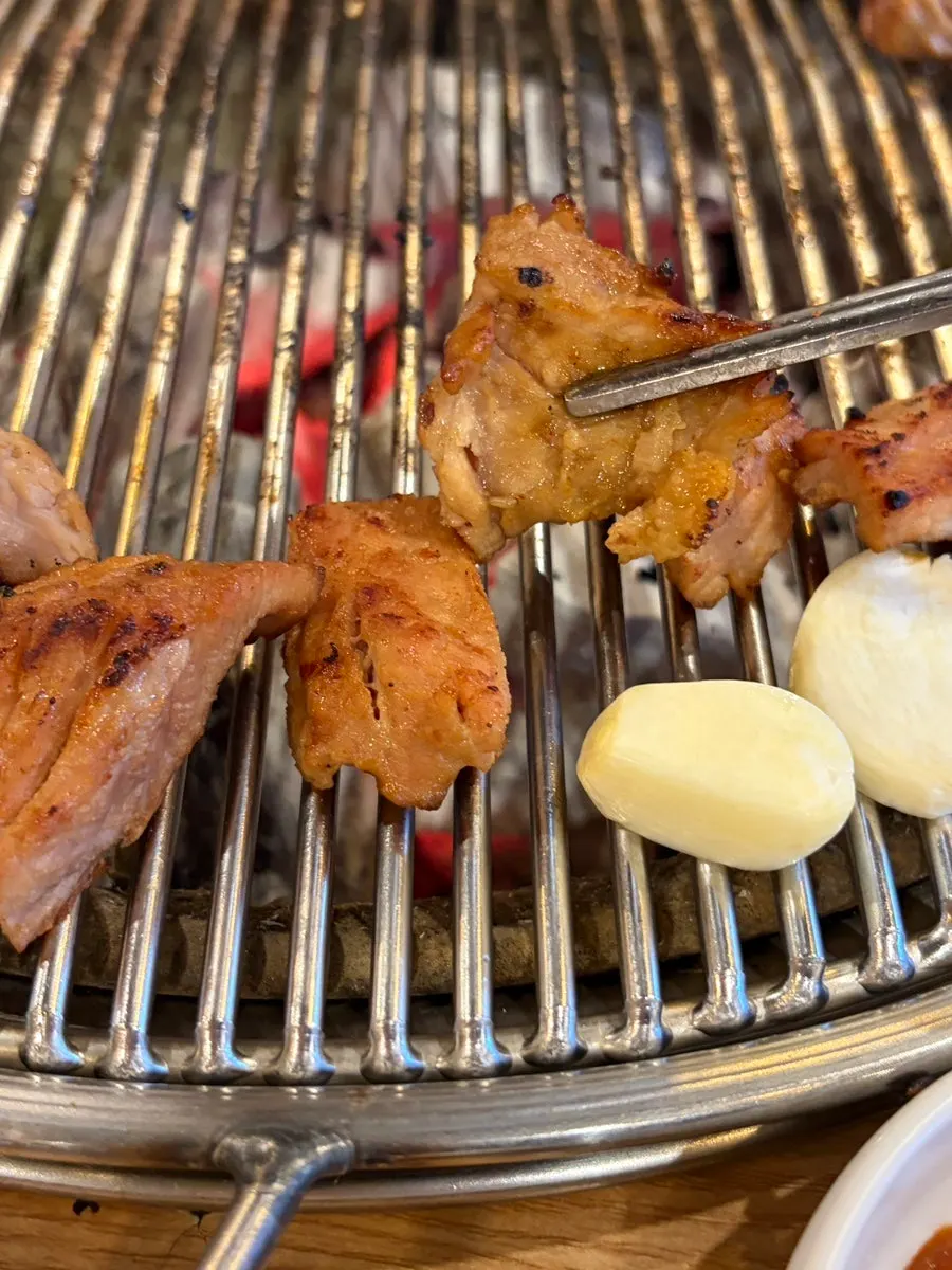 Pork ribs browning over charcoal