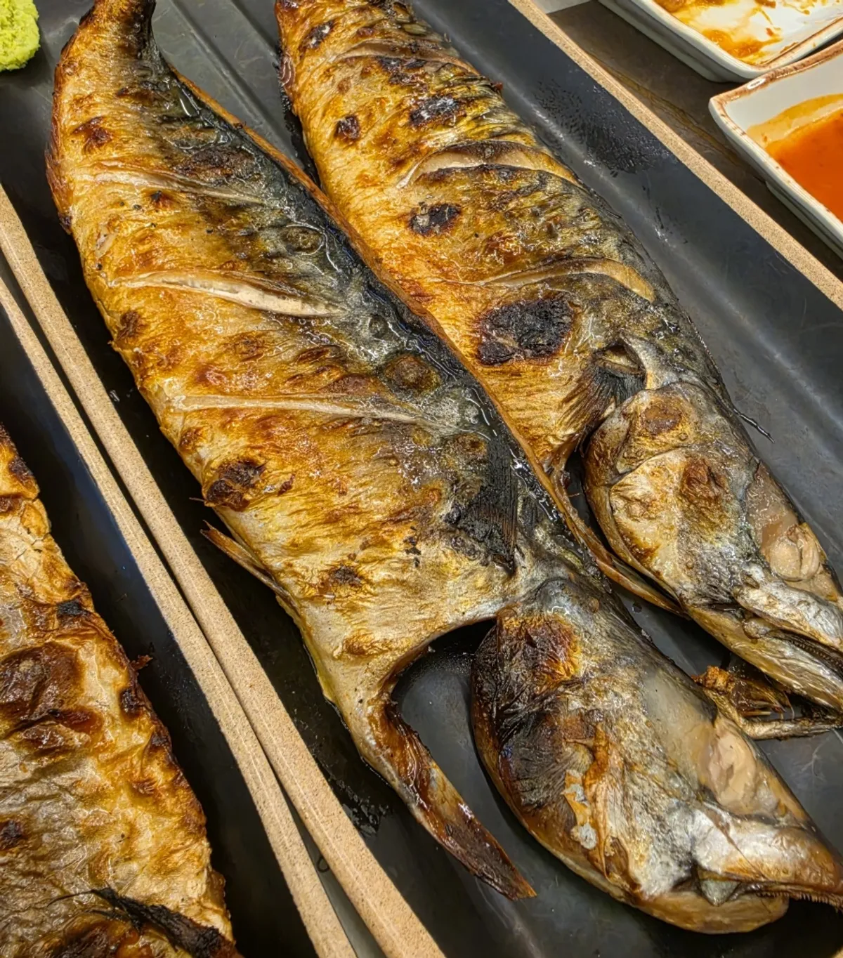 Oven-grilled fish table setting at Hwaddeugeuro Gan Godeungeo Bisan Branch