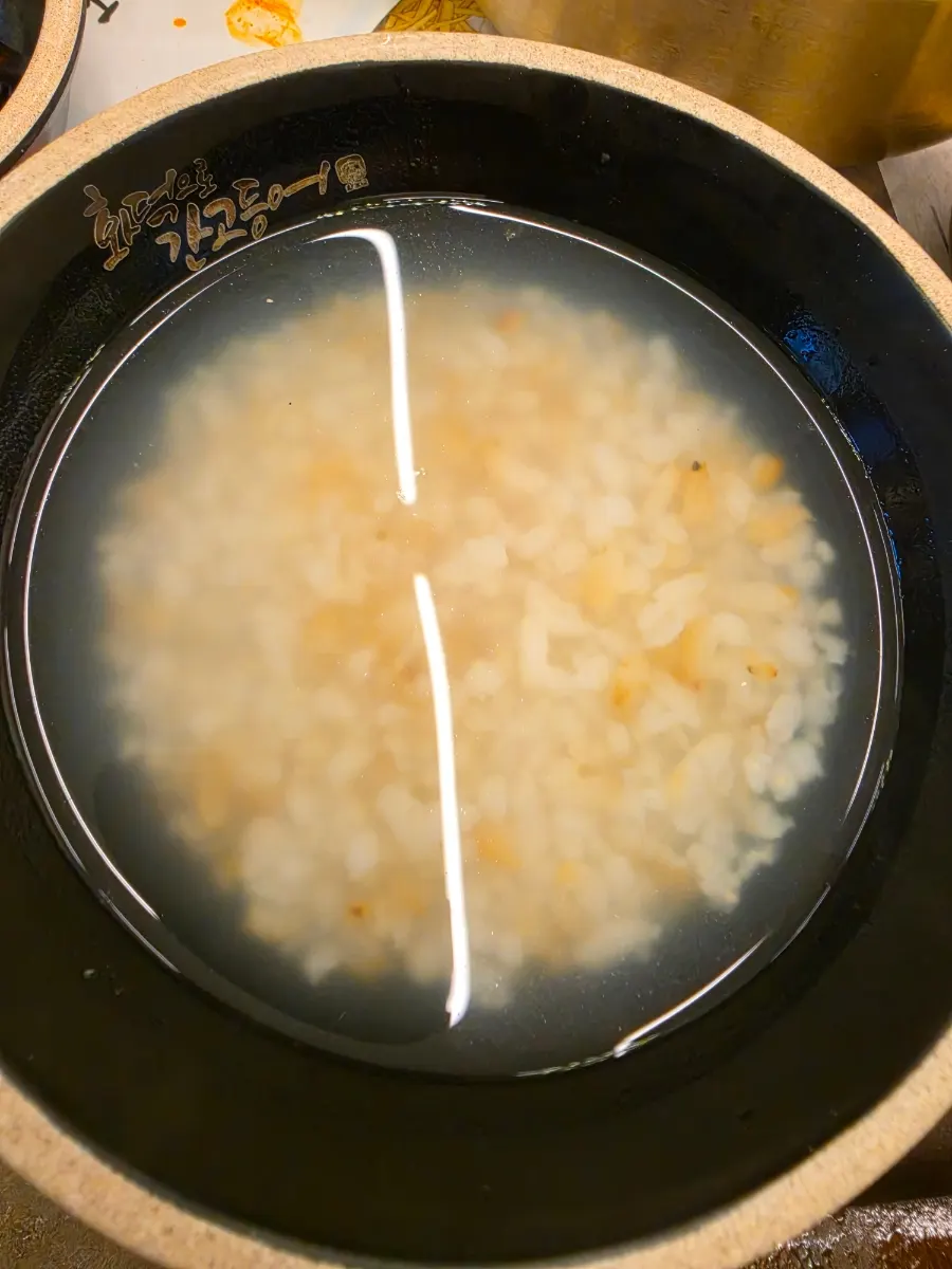 A bowl of tteokbokki from the self-bar eaten before the meal
