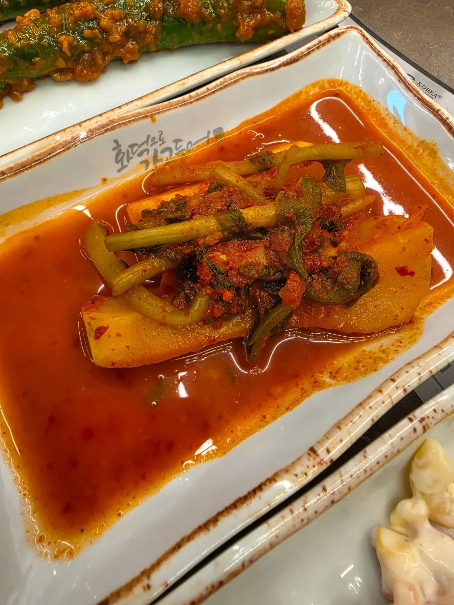 Grilled fish enjoyed with a spread of side dishes