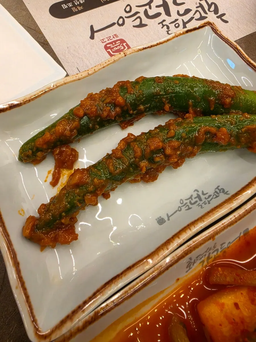 A spoonful of rice topped with fish meat