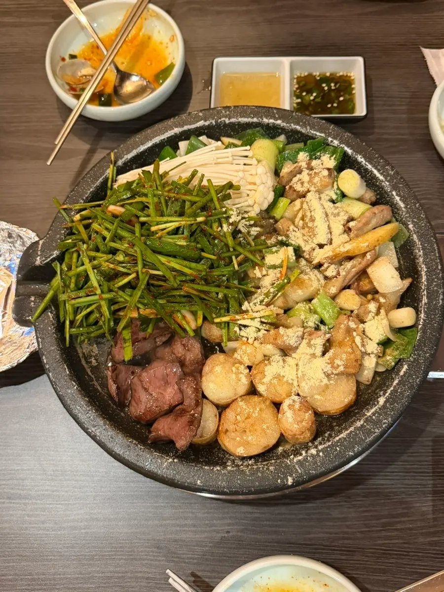 Gopchang and daechang cooking on the grill