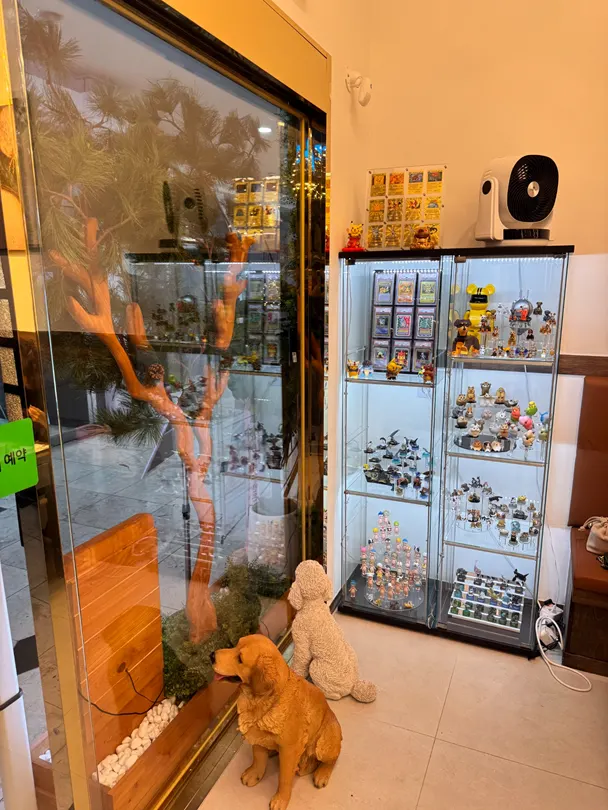 Character figures displayed in a case near the entrance