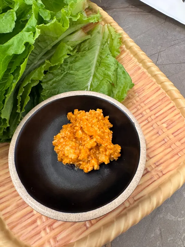 Japchae and tteokbokki set out at the self-bar