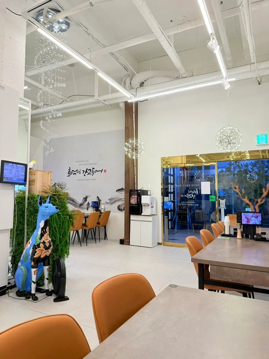 Spacious hall seating with generous spacing between tables