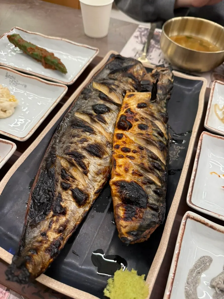 A piece of oven-grilled mackerel eaten with rice
