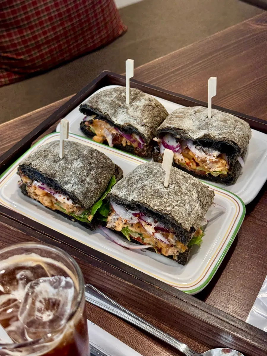 Cross-section of the squid ink ciabatta spicy chicken sandwich