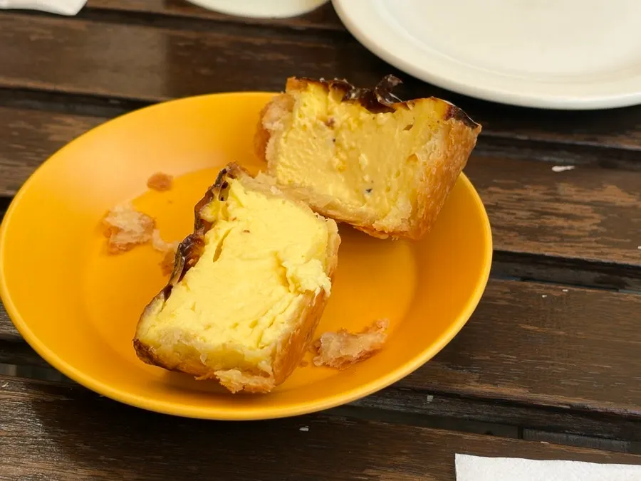 Coffee and egg tart on the outdoor table