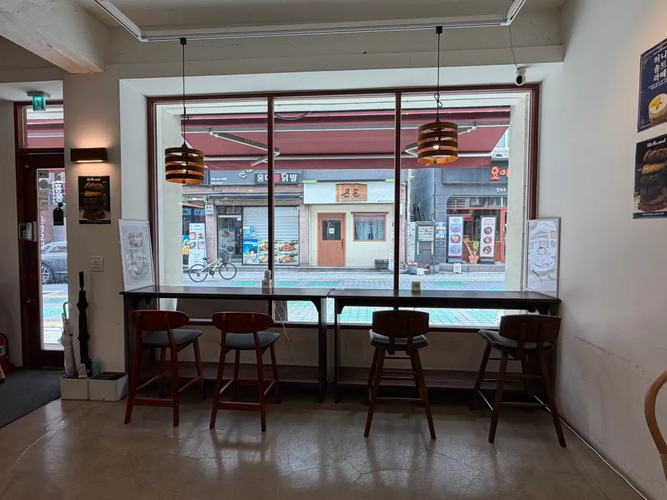 Seating by the picture window with an outside view