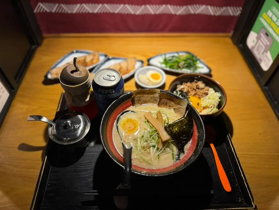 A bowl of Aori Ramen served at the table